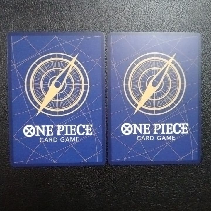 One Piece Monkey D. Luffy and Trafalgar Law SR parallel cards in protective sleeves