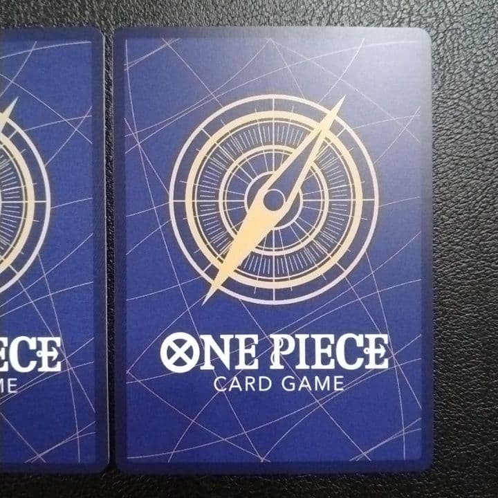 One Piece Monkey D. Luffy and Trafalgar Law SR parallel cards in protective sleeves