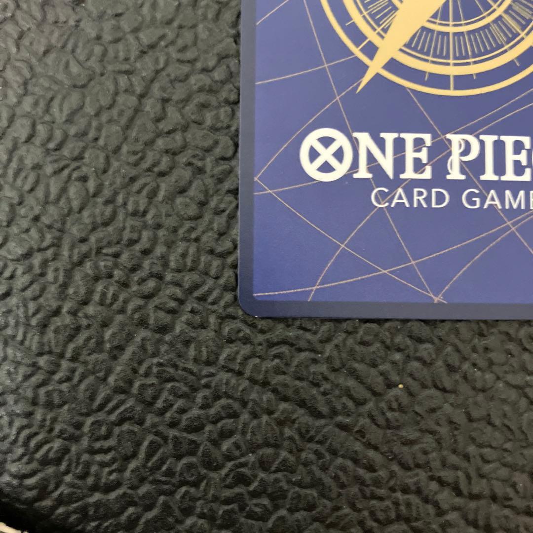 One Piece Nami SR Parallel card OP02-036 showing front design with visible wear and corner chip