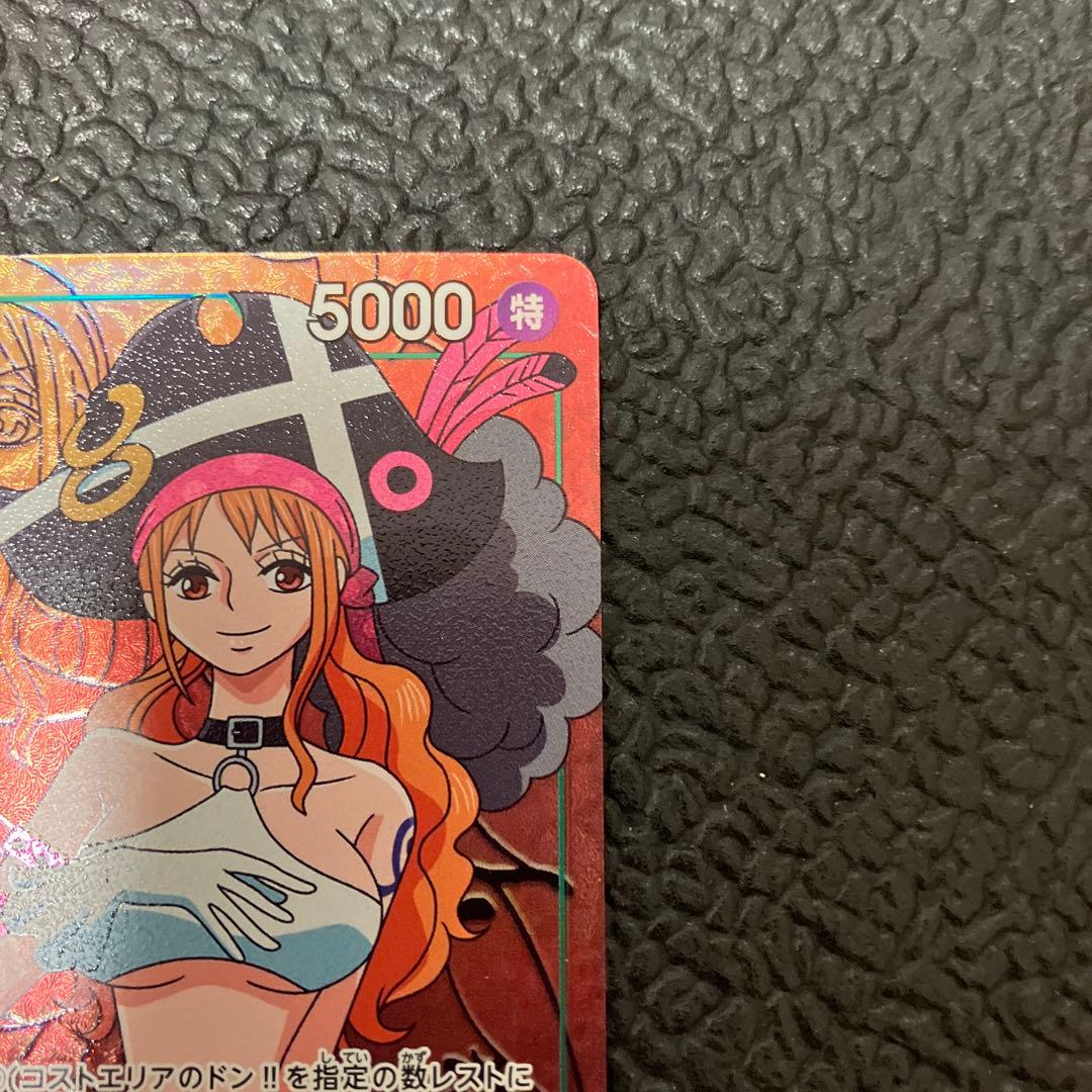 One Piece Nami SR Parallel card OP02-036 showing front design with visible wear and corner chip