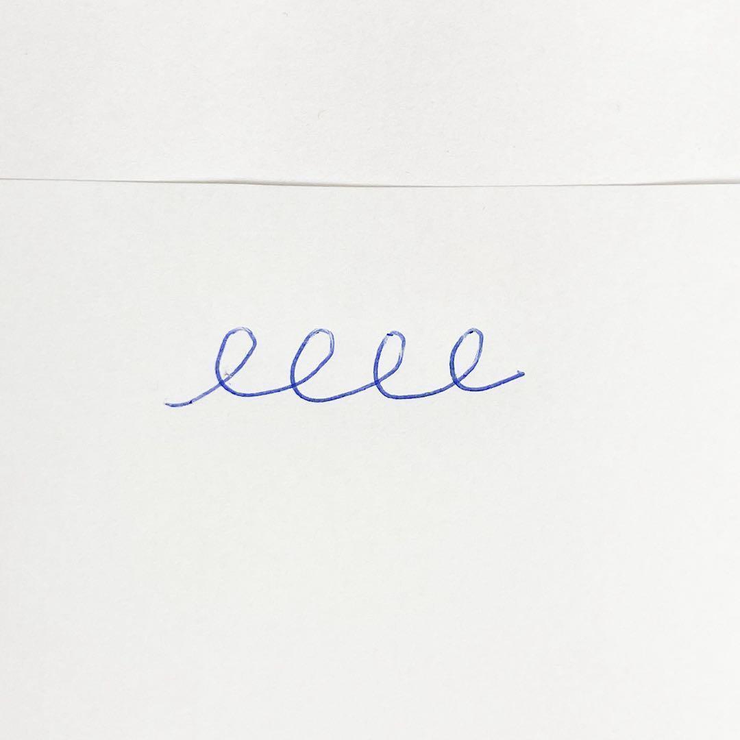 Used Cross brand silver ballpoint pen with blue ink shown on a white background