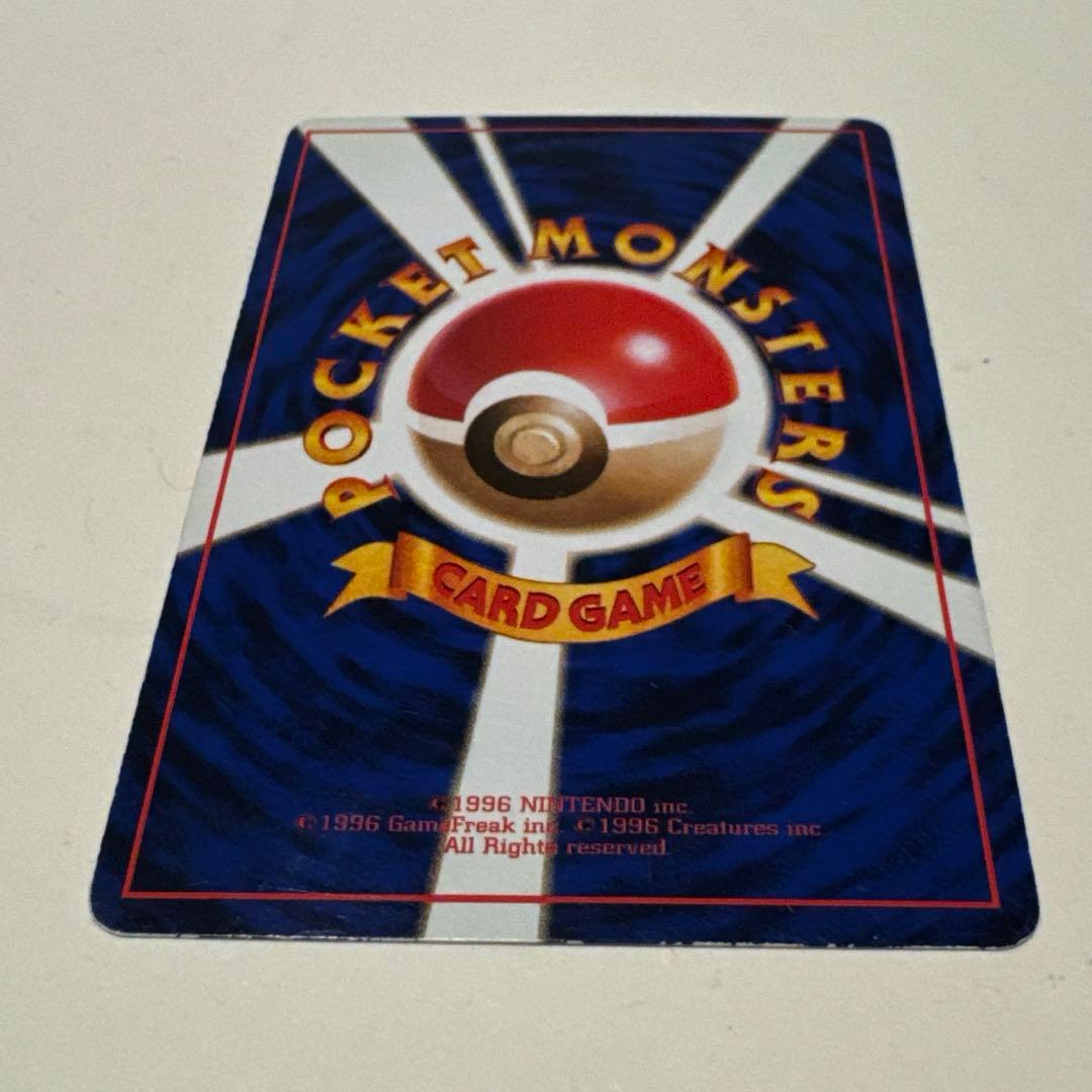 Used Pokemon Card featuring Mew Old Back Promo No.151 with visible scratches and white spots