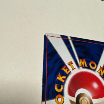 Used Pokemon Card featuring Mew Old Back Promo No.151 with visible scratches and white spots