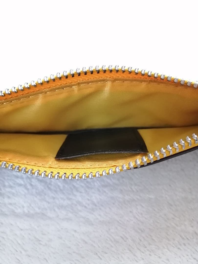 Cross brand leather pen case in used condition with visible scratches and stains