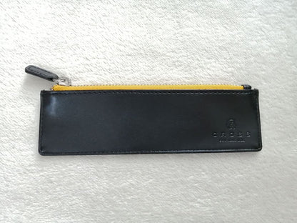 Cross brand leather pen case in used condition with visible scratches and stains