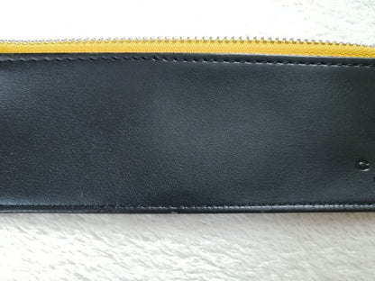 Cross brand leather pen case in used condition with visible scratches and stains