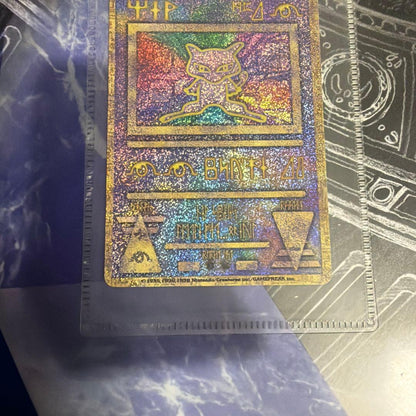 Ancient Mew First Edition Revision Pokemon card with Lugia birth pamphlet included in used condition