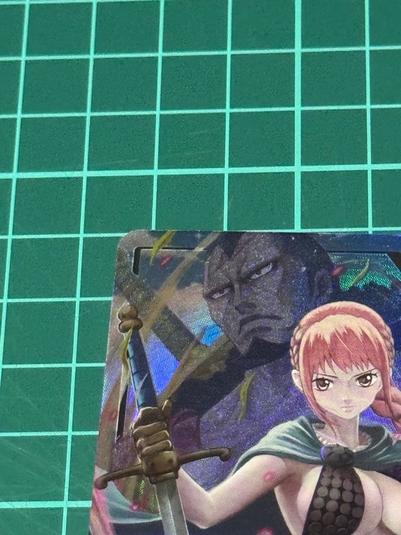 One Piece Rebecca Kingdom of Conspiracy Leader single trading card with slight wear and protective sleeve