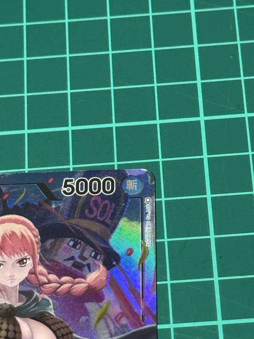 One Piece Rebecca Kingdom of Conspiracy Leader single trading card with slight wear and protective sleeve