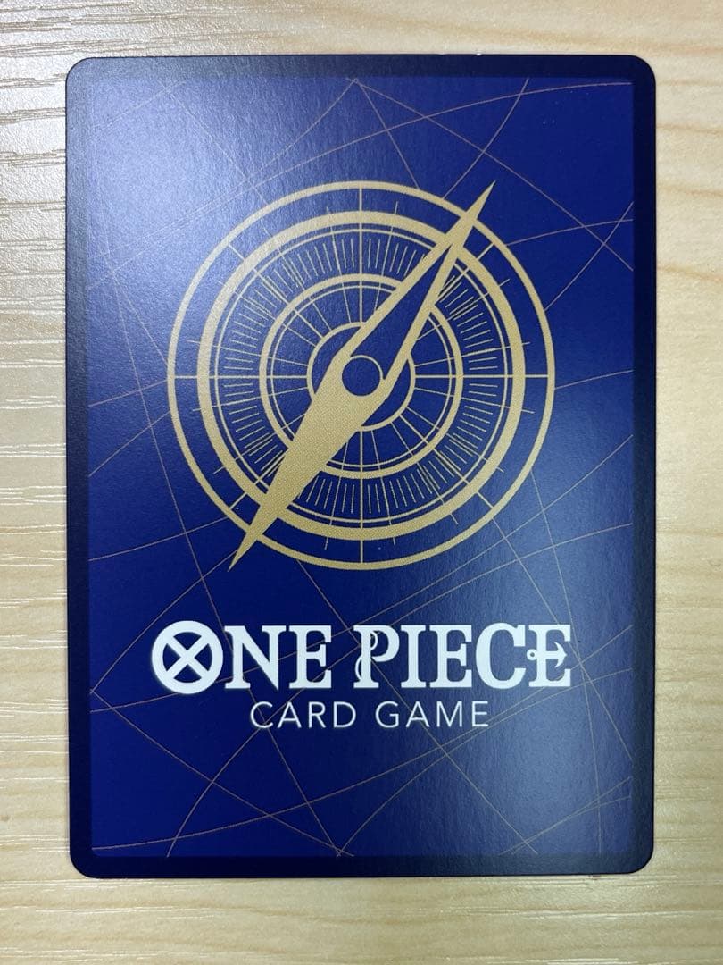 One Piece Monster D. Luffy 1st Anniversary Promo English version card with visible surface wear and white fade on the back