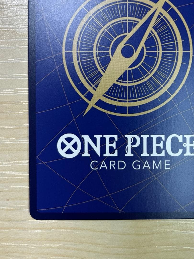 One Piece Monster D. Luffy 1st Anniversary Promo English version card with visible surface wear and white fade on the back