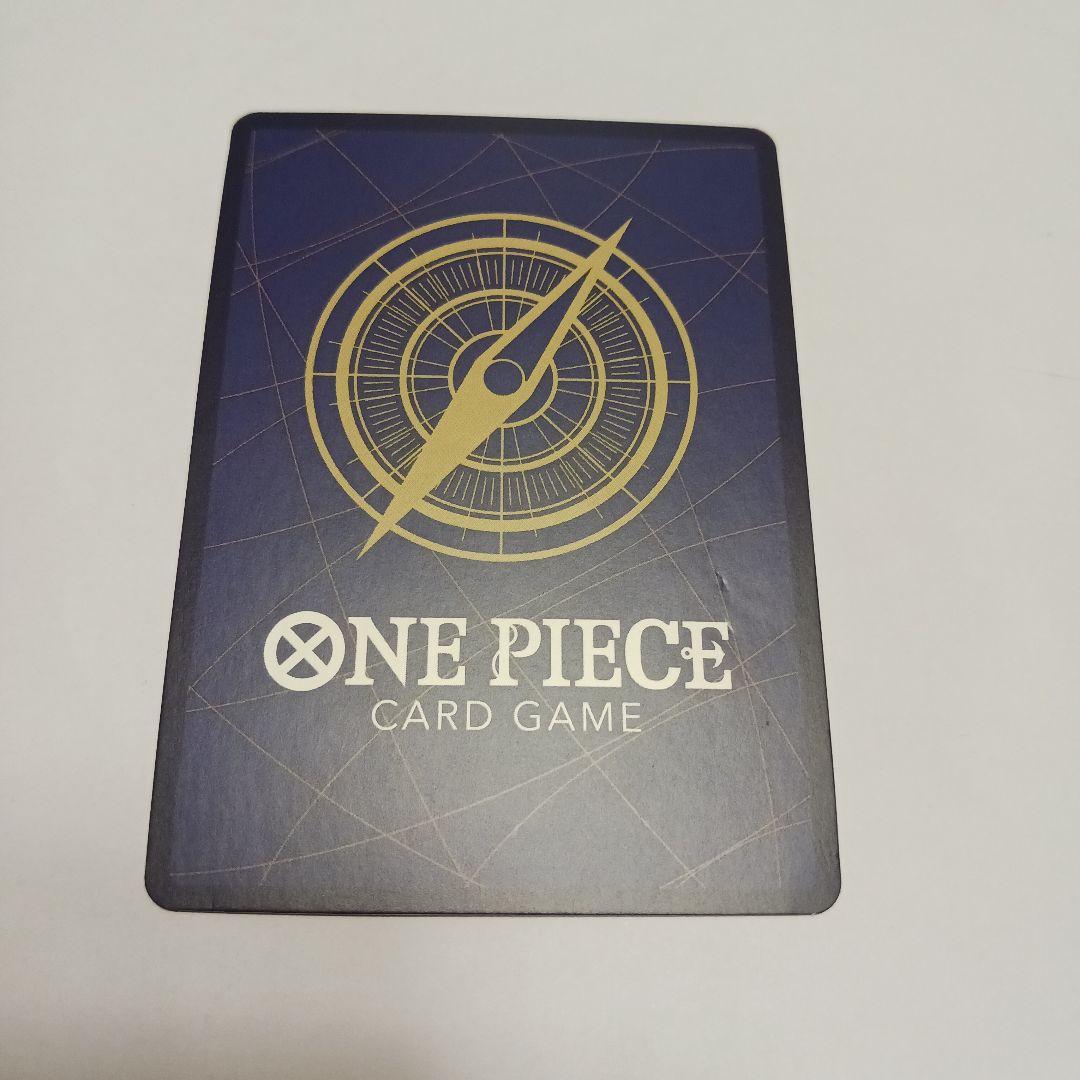 One Piece Monkey D. Luffy P-043 card showing Luffy wearing a crown sitting in a treasure chest