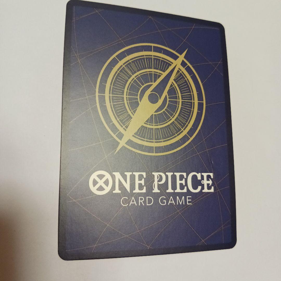 One Piece Monkey D. Luffy P-043 card showing Luffy wearing a crown sitting in a treasure chest