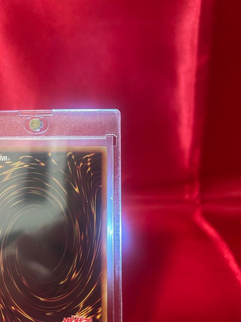 Yu-Gi-Oh Black Magician reprint card in sleeve and hard protective case
