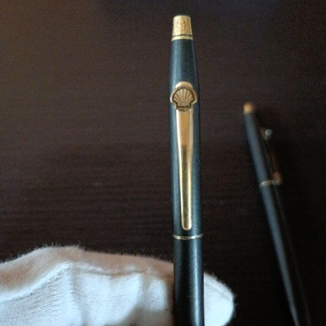 Cross twist ballpoint pen and mechanical pencil set in matte black with gold accents and shell logo