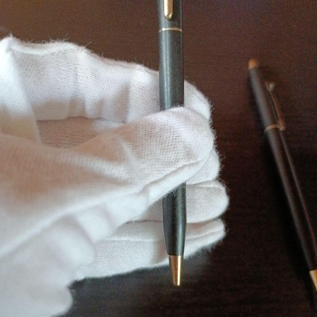 Cross twist ballpoint pen and mechanical pencil set in matte black with gold accents and shell logo