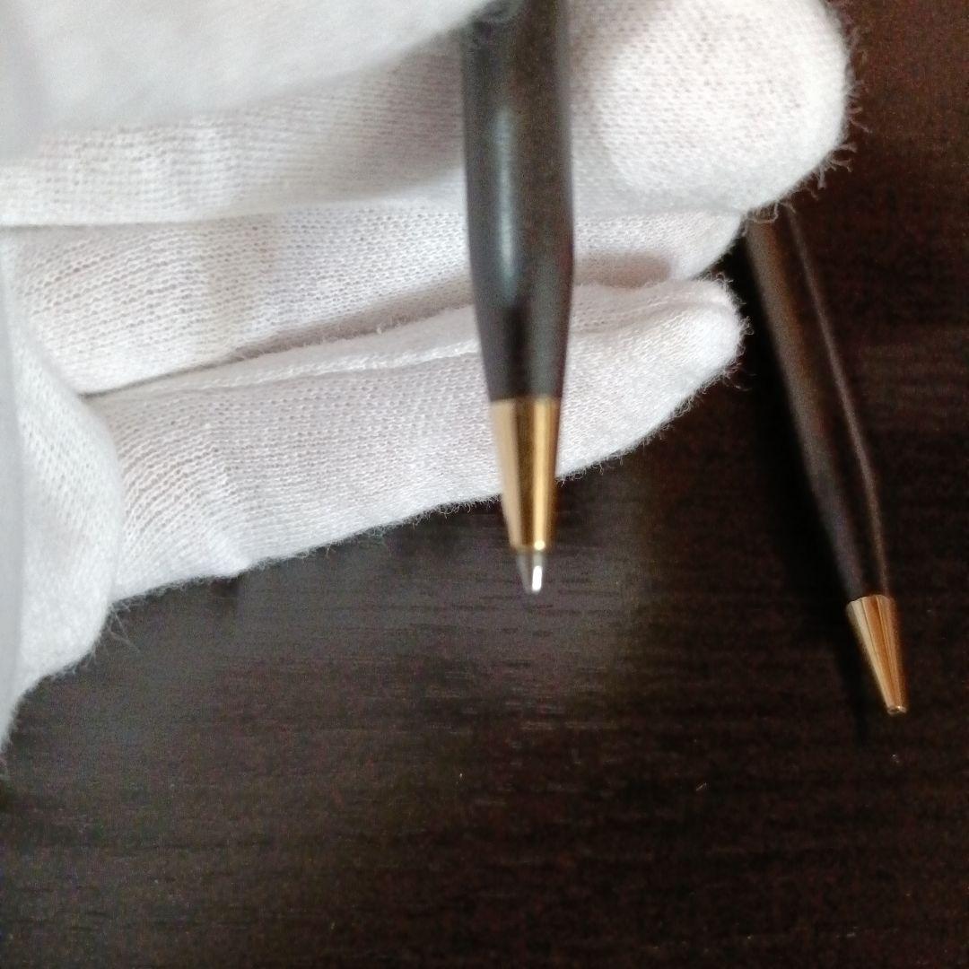 Cross twist ballpoint pen and mechanical pencil set in matte black with gold accents and shell logo