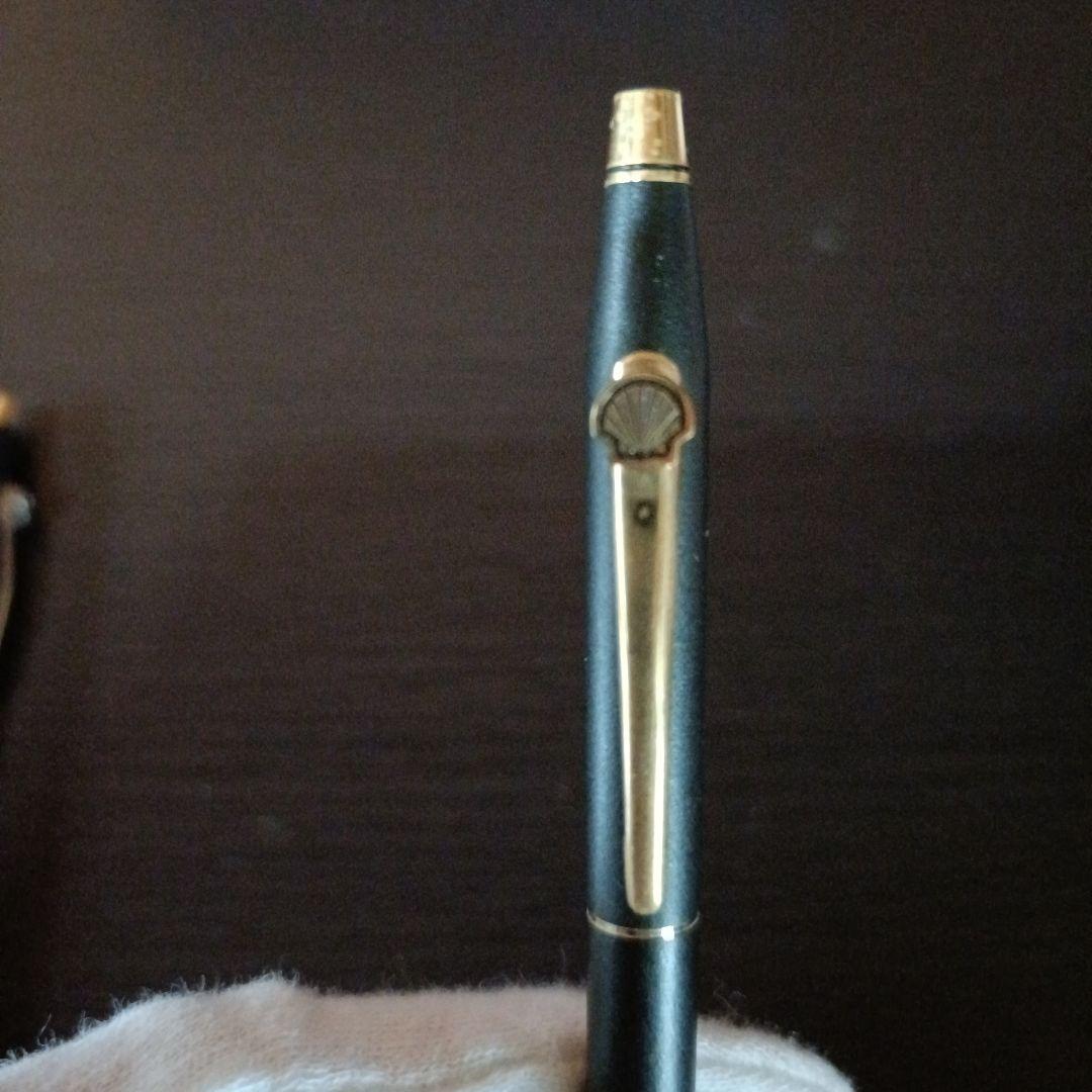 Cross twist ballpoint pen and mechanical pencil set in matte black with gold accents and shell logo