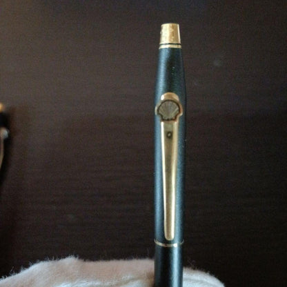 Cross twist ballpoint pen and mechanical pencil set in matte black with gold accents and shell logo