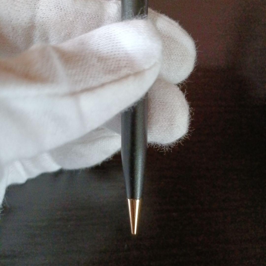 Cross twist ballpoint pen and mechanical pencil set in matte black with gold accents and shell logo