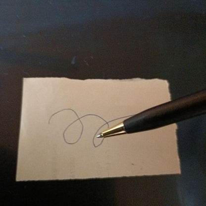 Cross twist ballpoint pen and mechanical pencil set in matte black with gold accents and shell logo
