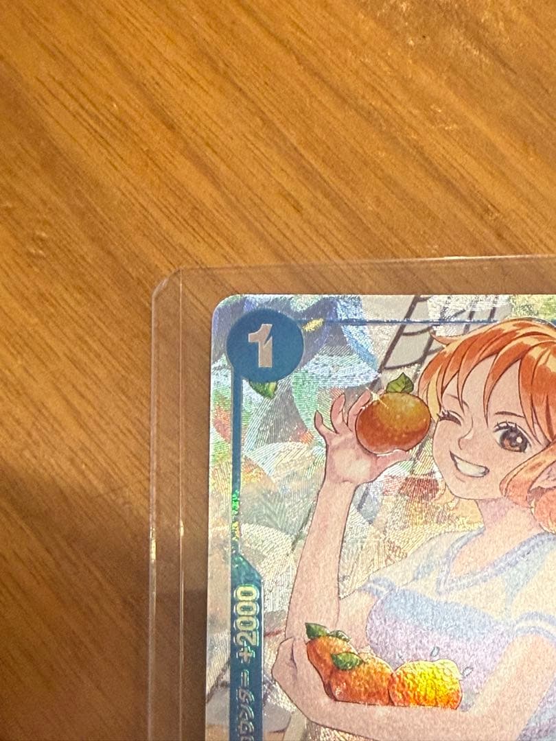 One Piece Nami P-053 Promo Parallel trading card in sleeve and loader from the One Piece card game