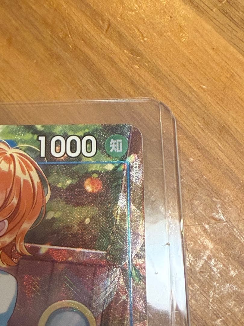 One Piece Nami P-053 Promo Parallel trading card in sleeve and loader from the One Piece card game