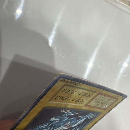 Yugioh Blue-Eyes White Dragon Ultra Rare Early Edition trading card showing signs of use and corner creases