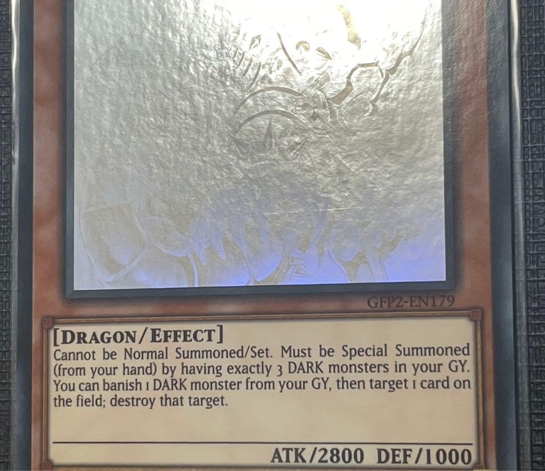 Sony Dark Armed Dragon Ghost Rare Yu-Gi-Oh trading card with visible overseas scratch marks
