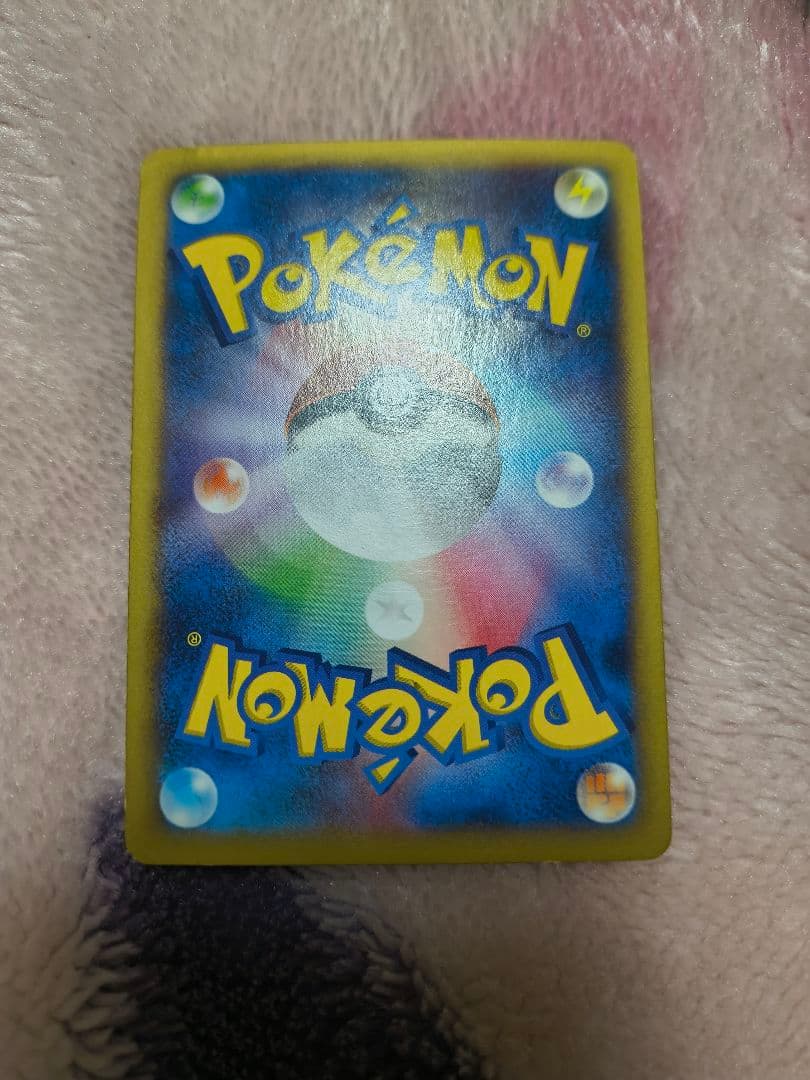 Mega Charizard Y Pokemon trading card sleeved for protection, authentic Japan import