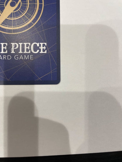 One Piece Marshall D. Teach collectible card in protective sleeve and case showing minor wear