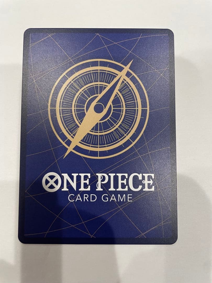 One Piece Marshall D. Teach collectible card in protective sleeve and case showing minor wear