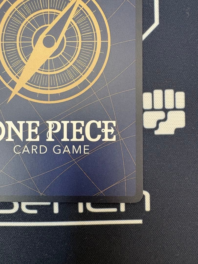 One Piece Card Game Gum-Gum Golden Rotation Bullet Parallel OP05-116 R card with visible white cracks from initial scratches