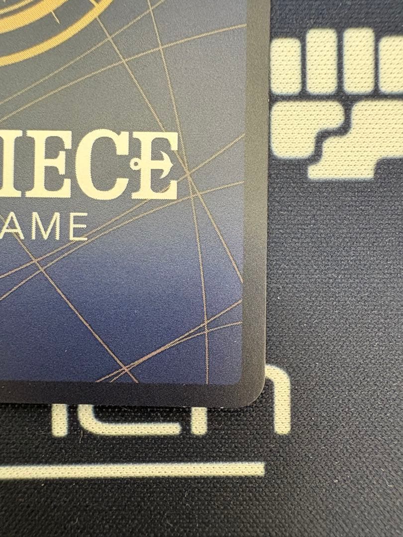One Piece Card Game Gum-Gum Golden Rotation Bullet Parallel OP05-116 R card with visible white cracks from initial scratches