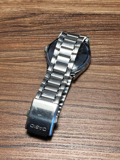 Casio MTP-1239DJ Quartz Watch with Day Date and Silver Sunray Dial — Japan Import