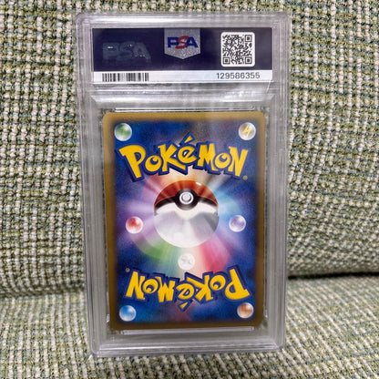 Pikachu World Portugal PSA10 Pokémon card promo box with graded cards including Pikachu and Charizard