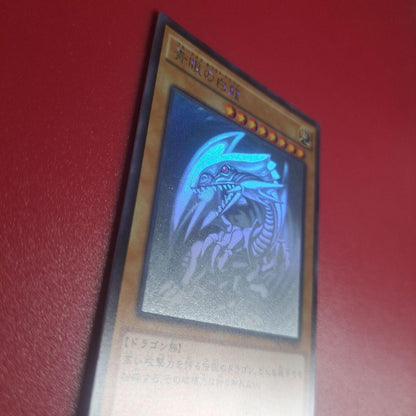 Yugioh Blue-Eyes White Dragon Holographic Rare TRC card with fine scratches Japanese import