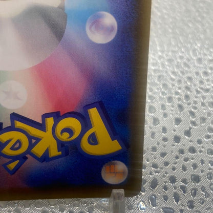 Limited edition Mew UR 25th Anniversary Pokemon collectible card with gold finish and logo collage from Japan