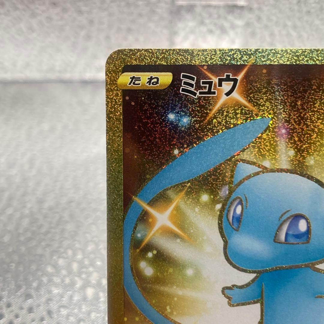 Limited edition Mew UR 25th Anniversary Pokemon collectible card with gold finish and logo collage from Japan