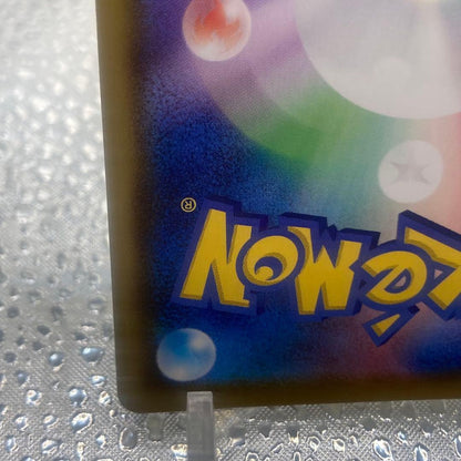 Limited edition Mew UR 25th Anniversary Pokemon collectible card with gold finish and logo collage from Japan