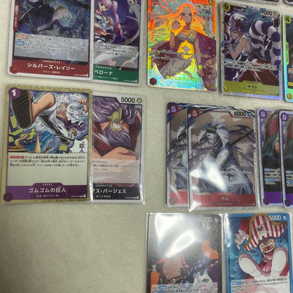 One Piece card set with Monkey D. Luffy SR, Sabo SR, Shanks R, and other rare cards in protective sleeves