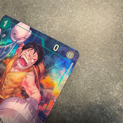 One Piece Monkey D. Luffy OP16-034 trading card in protective sleeve