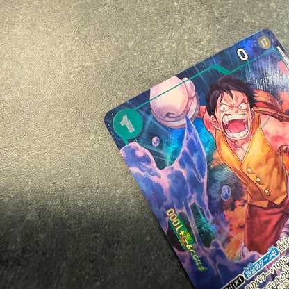 One Piece Monkey D. Luffy OP16-034 trading card in protective sleeve