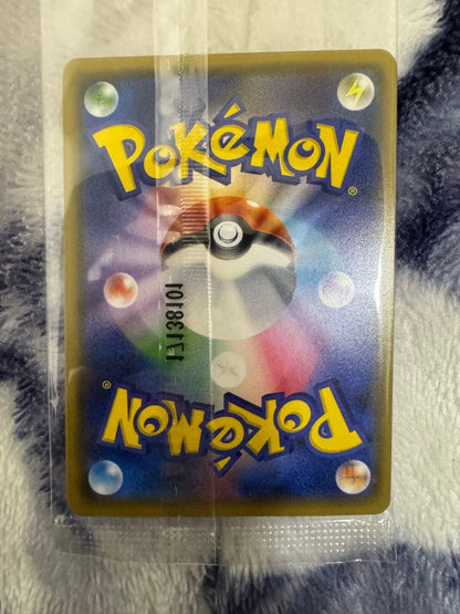 Bandai Pokemon Card Lele Promo from Japan import sealed in a loader, displayed on a dark background