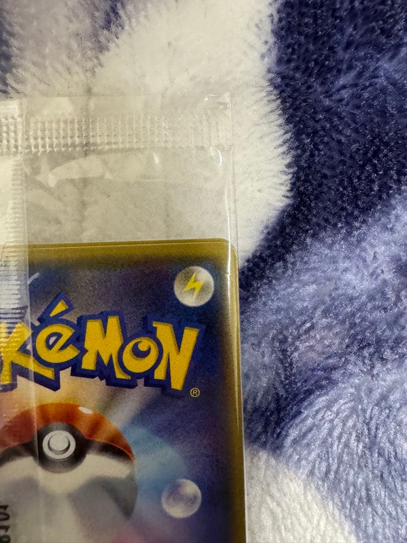 Bandai Pokemon Card Lele Promo from Japan import sealed in a loader, displayed on a dark background