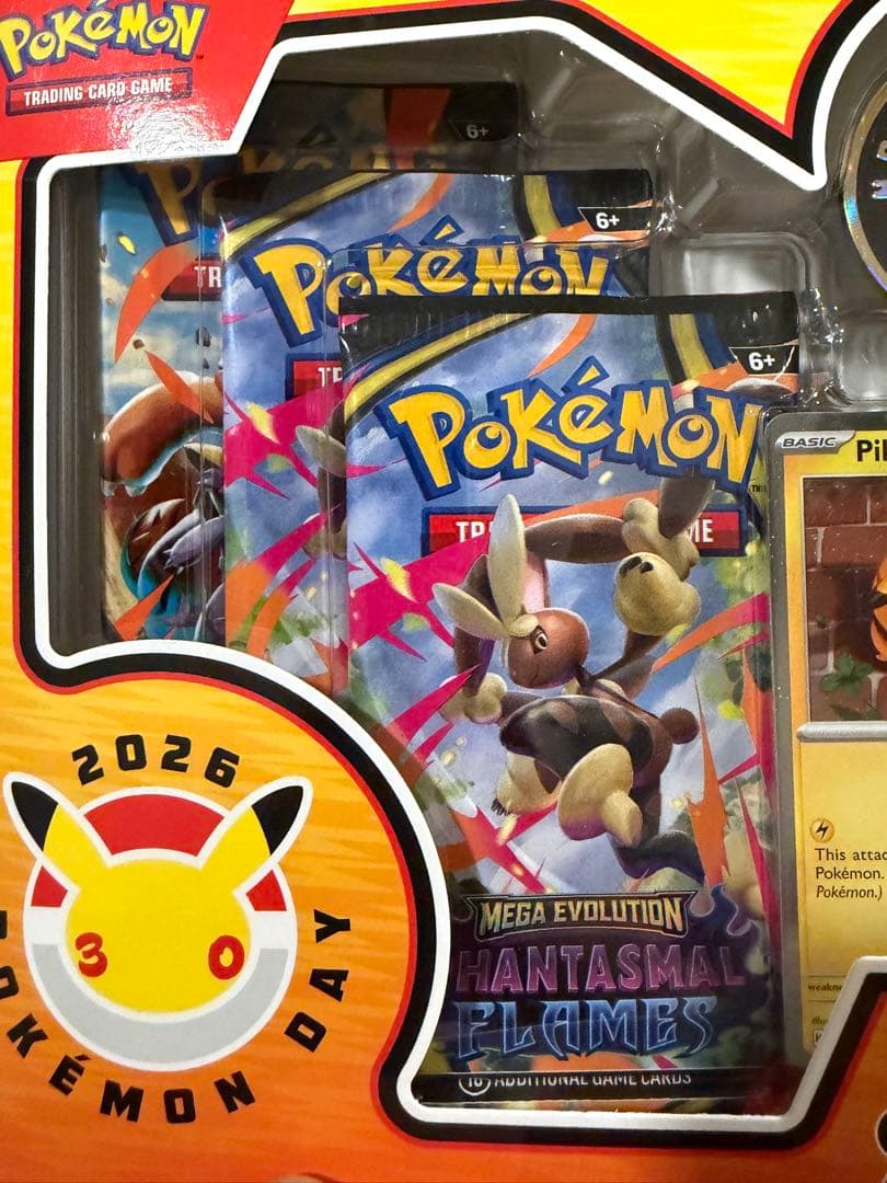 Unopened Pokemon Day 2026 Collection Box Japan Import showing promo card, special coin, and three expansion packs in English