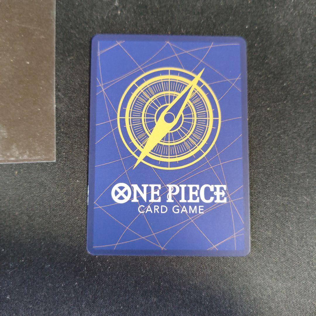 One Piece Monkey D. Luffy P-043 collectible card showing front with minor scratches and paint peeling on back