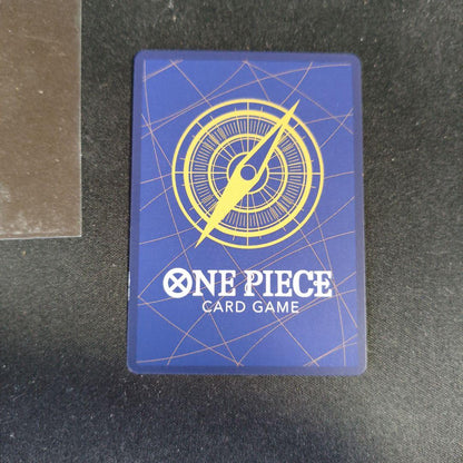 One Piece Monkey D. Luffy P-043 collectible card showing front with minor scratches and paint peeling on back