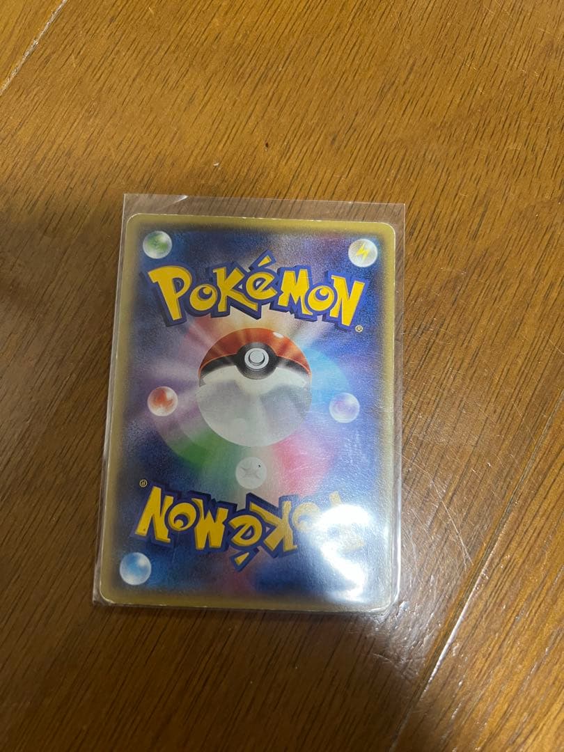 Bandai Rakueza Ex Pokemon card featuring 170 HP, Rising Burn and Dragon Pulse attacks in a rigid case