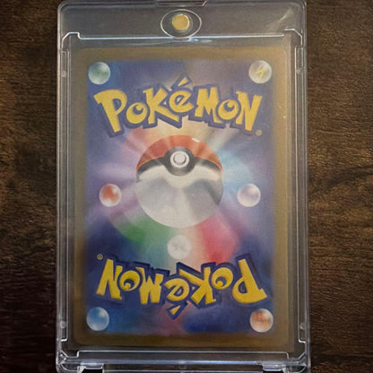 Pokemon Card Blissey with 110 HP and Master Ball Mirror design showing moves Trick and Gleaming Fang